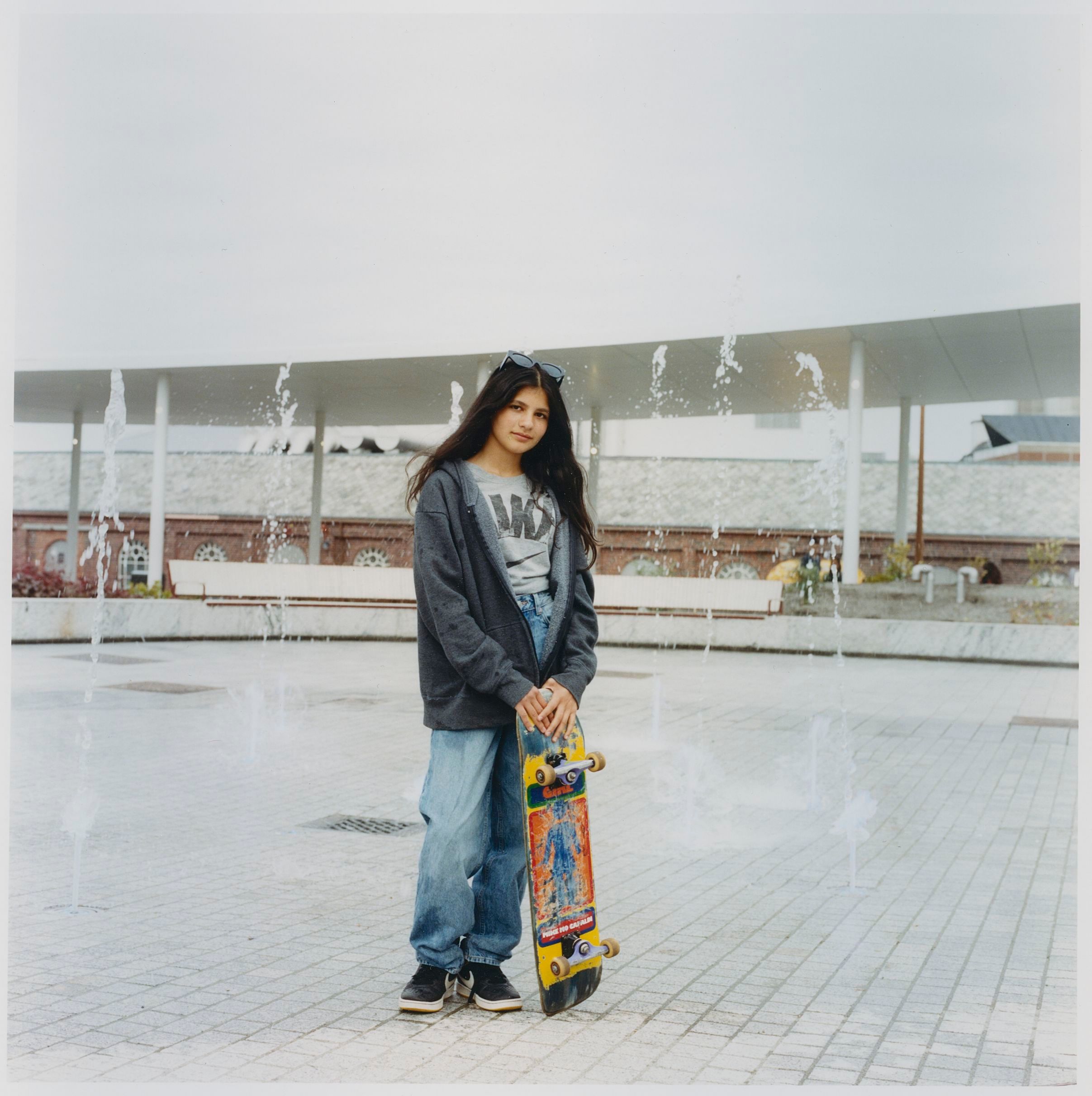 Photo of young girl holding a skateboard
